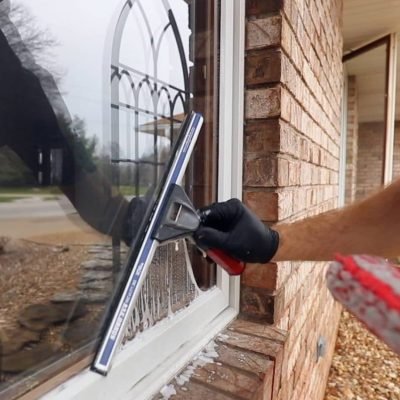 Professional residential window cleaning in the Marysville area using a squeegee